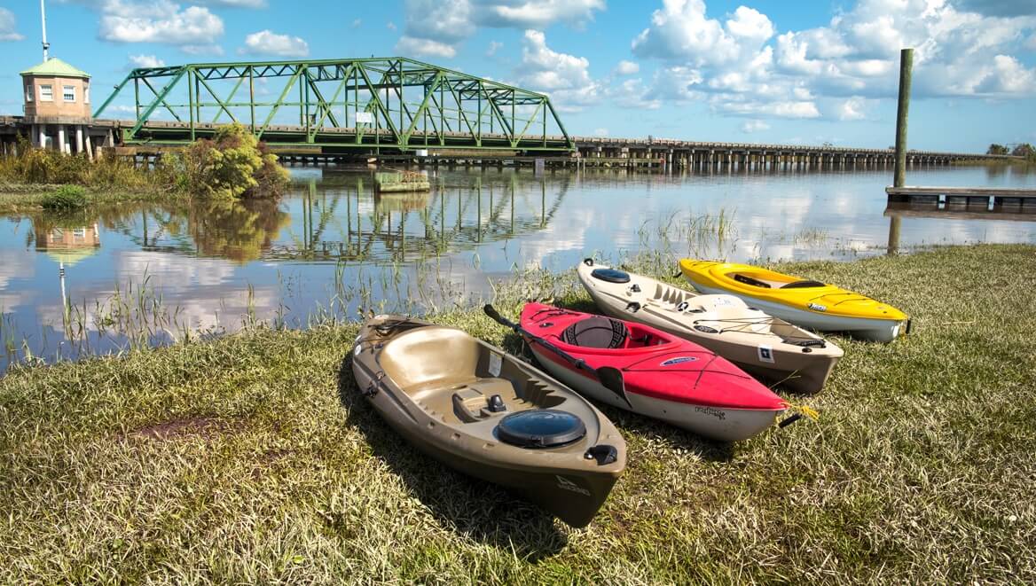 Kayaks ready for an adventure on the Savannah River, inviting exploration of the natural beauty at Savannah National Wildlife Refuge.